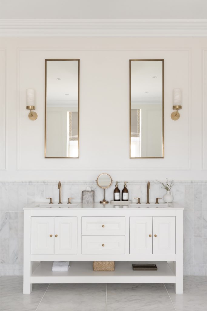 Sleek dresser interior designed with symmetrical mirrors and wall lights