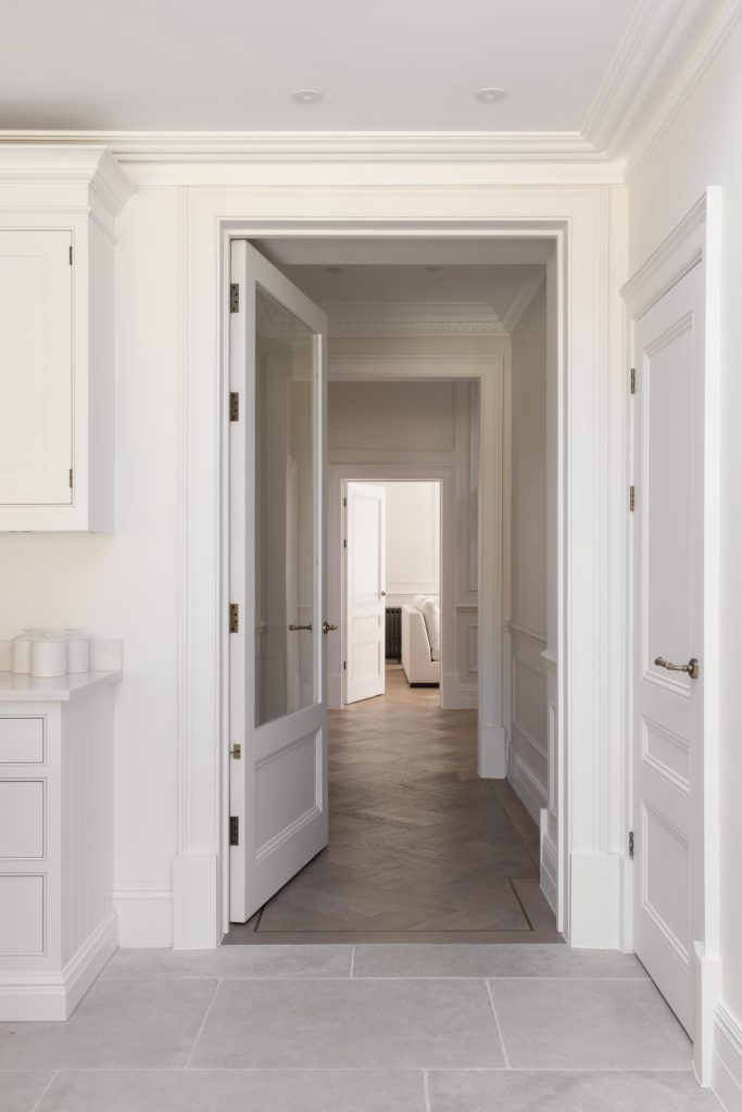 View from light kitchen through to living room