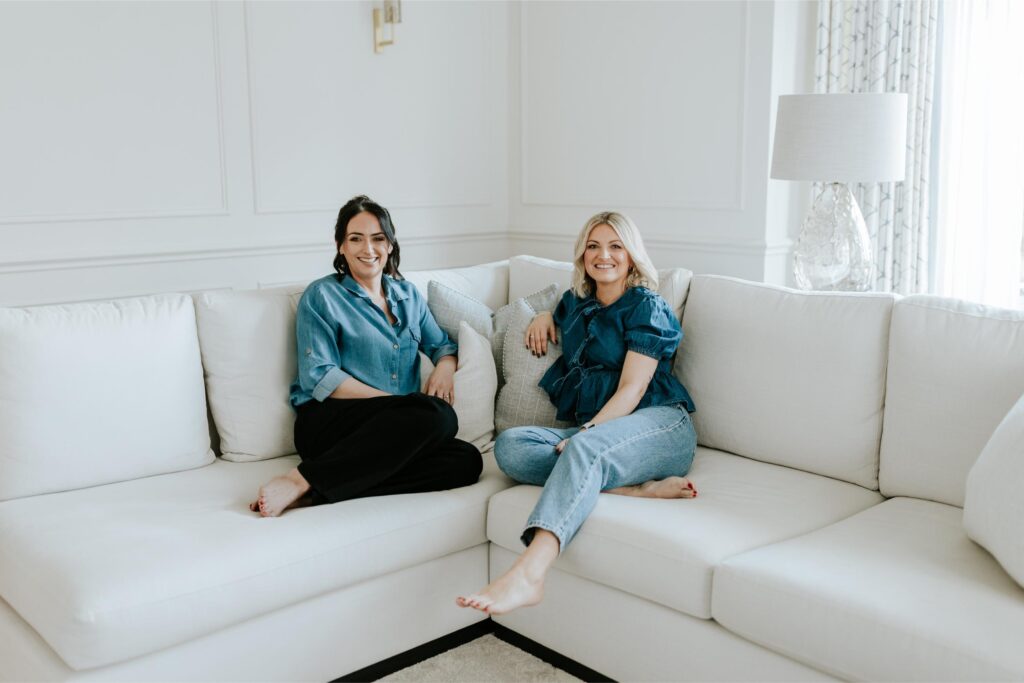 wells and maguire landscape shot of the team sitting on a sofa